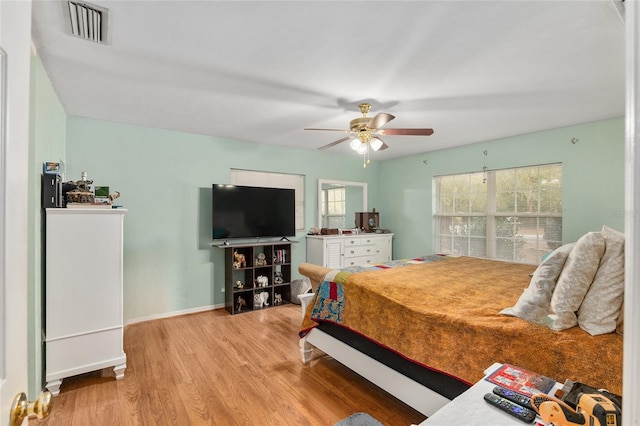 bedroom featuring ceiling fan and light hardwood / wood-style flooring