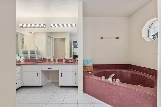 bathroom with vanity, a bathtub, and tile patterned flooring