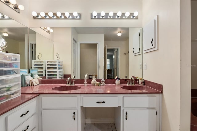 bathroom featuring tile patterned floors and vanity