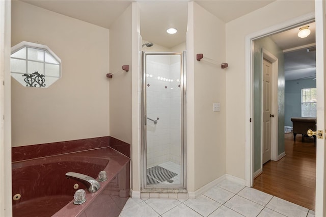 bathroom with tile patterned floors and plus walk in shower