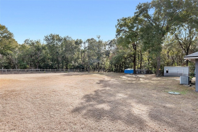 view of yard with central AC