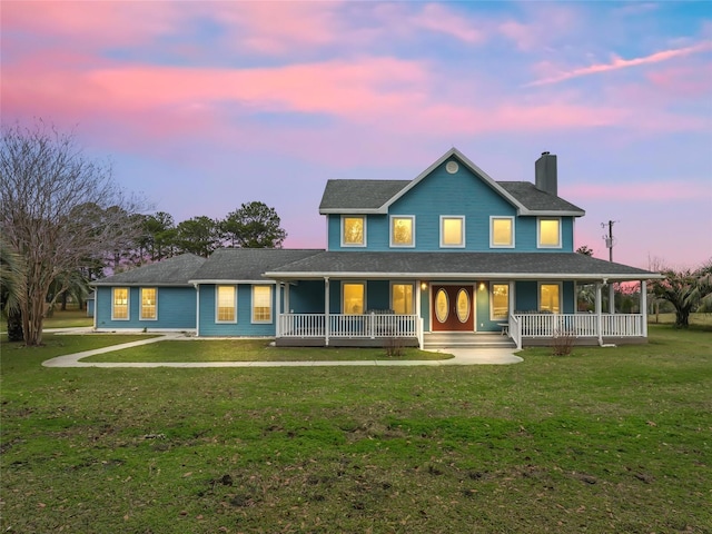 view of front of home featuring a yard and covered porch