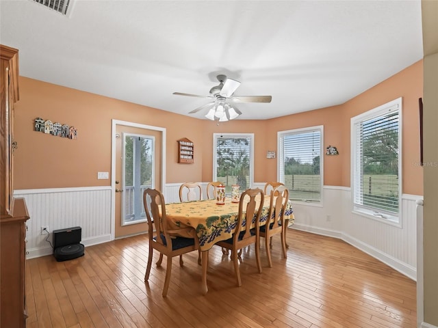 dining area featuring a wealth of natural light, light hardwood / wood-style floors, and ceiling fan