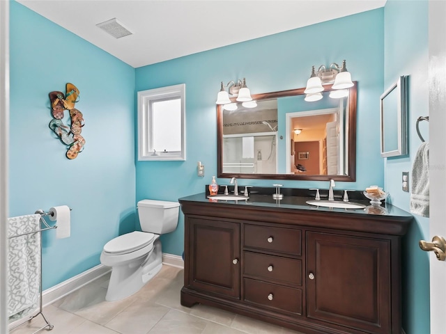 bathroom featuring tile patterned floors, toilet, an enclosed shower, and vanity