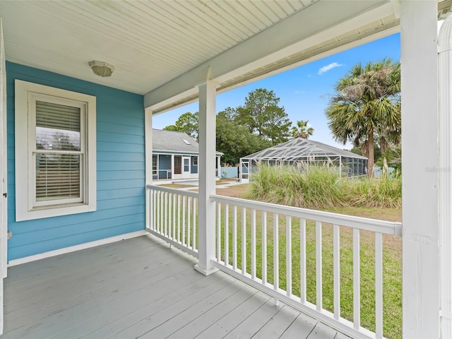 deck featuring a yard and a lanai