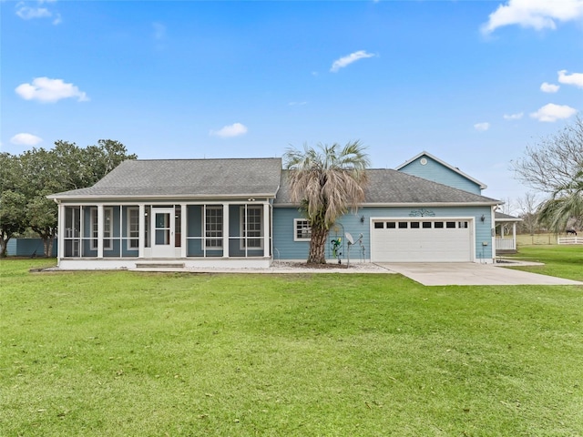 ranch-style home with a garage, a sunroom, and a front yard