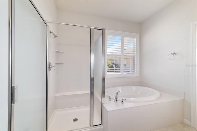 bathroom with separate shower and tub