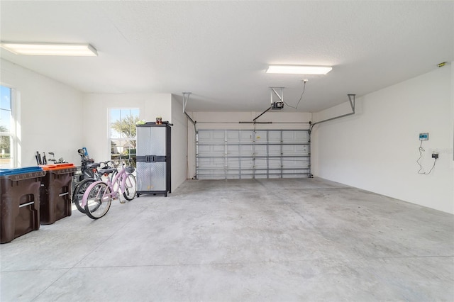 garage featuring a garage door opener