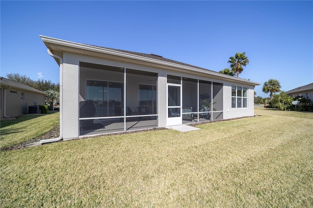 back of house with a yard, central AC, and a sunroom