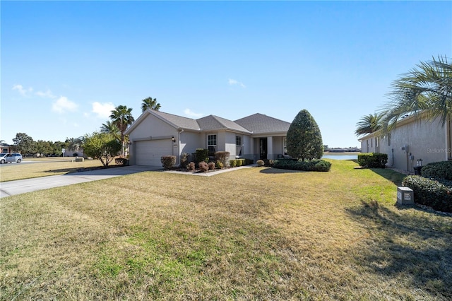 ranch-style home featuring a garage and a front yard