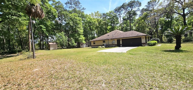 7651 SE 36th Ave, Ocala, FL 34480 - view of yard featuring an outdoor structure, a garage, a storage unit, and concrete driveway