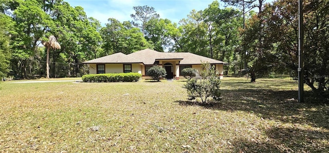 7651 SE 36th Ave, Ocala, FL 34480 - view of front of property featuring stucco siding and a front lawn