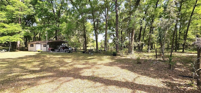 7651 SE 36th Ave, Ocala, FL 34480 - view of yard with an outbuilding and a carport