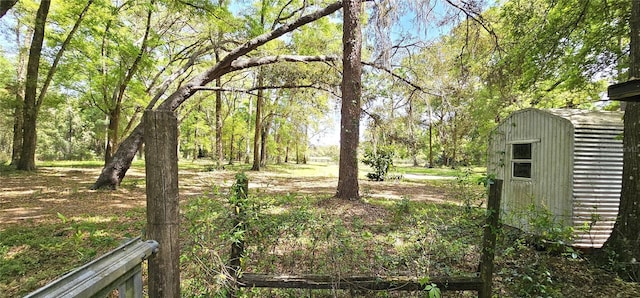 7651 SE 36th Ave, Ocala, FL 34480 - view of yard with a storage unit and an outdoor structure