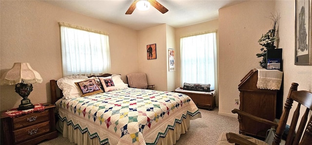 7651 SE 36th Ave, Ocala, FL 34480 - bedroom with a ceiling fan, multiple windows, and light colored carpet