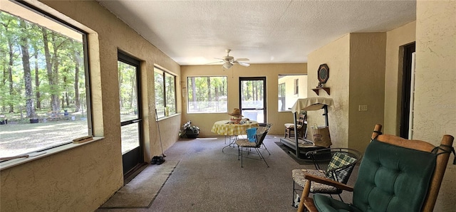7651 SE 36th Ave, Ocala, FL 34480 - sunroom featuring carpet floors, a textured wall, and a textured ceiling