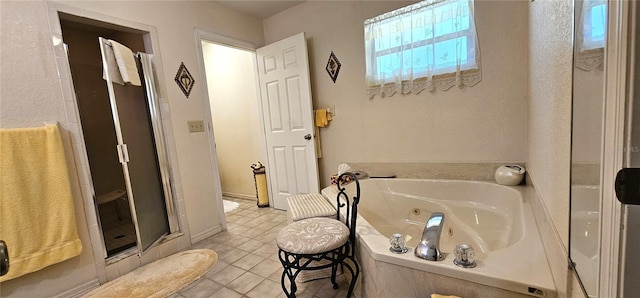 7651 SE 36th Ave, Ocala, FL 34480 - bathroom with a jetted tub, a stall shower, and tile patterned floors