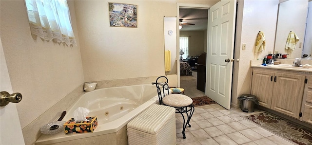 7651 SE 36th Ave, Ocala, FL 34480 - full bath with a ceiling fan, tile patterned floors, vanity, and a whirlpool tub