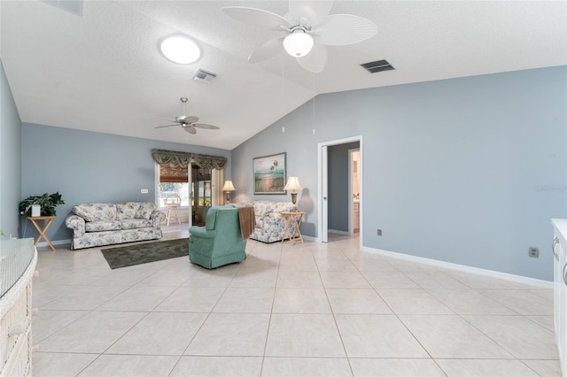 living room with light tile patterned flooring, lofted ceiling, a textured ceiling, and ceiling fan