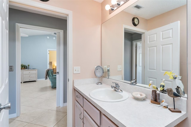 bathroom with tile patterned flooring and vanity