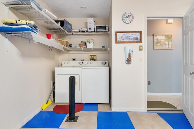 laundry room with washer and dryer