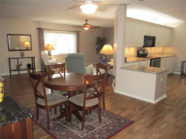 dining room with baseboards and dark wood finished floors