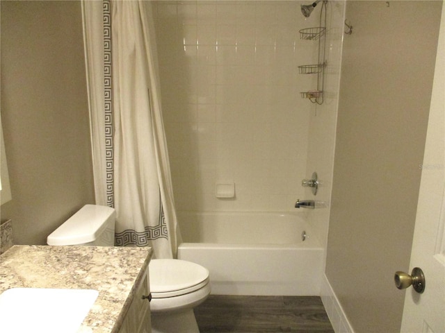 full bath featuring toilet, shower / tub combo, wood finished floors, and vanity