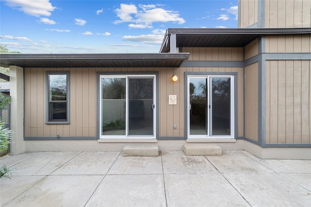 doorway to property featuring a patio area