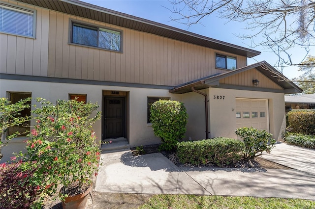 townhome / multi-family property featuring an attached garage