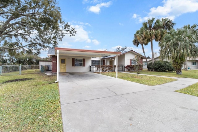 ranch-style house featuring a carport and a front lawn