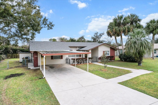 ranch-style house featuring a carport and a front yard