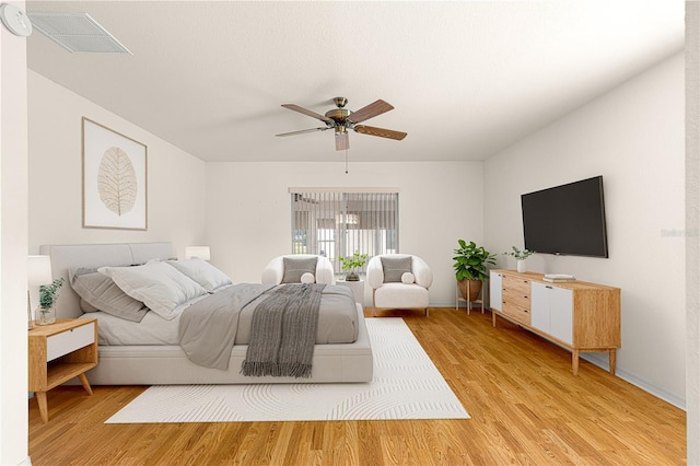 bedroom featuring light hardwood / wood-style flooring and ceiling fan