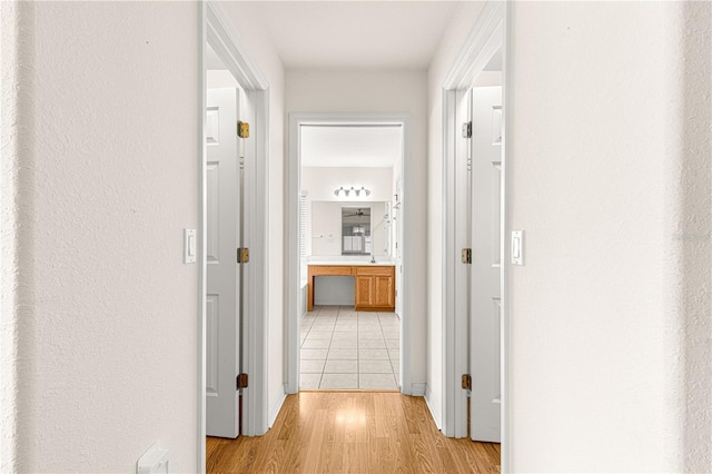 corridor featuring light hardwood / wood-style floors