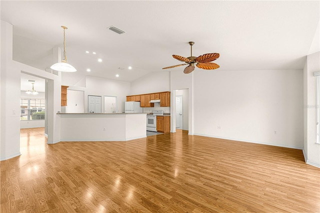 unfurnished living room with high vaulted ceiling, light hardwood / wood-style floors, and ceiling fan