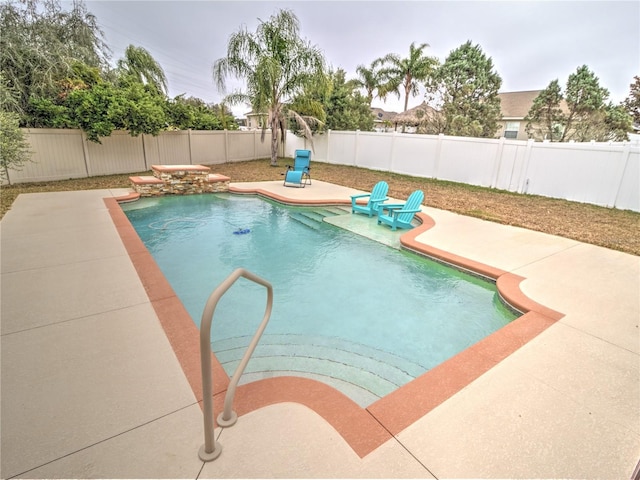 view of pool featuring a patio area