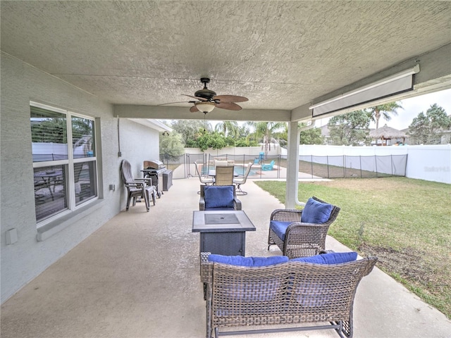 view of patio / terrace with ceiling fan and outdoor lounge area