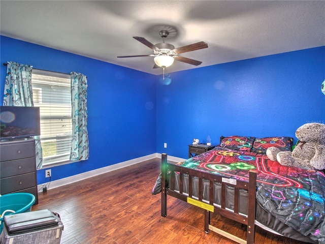 bedroom featuring hardwood / wood-style flooring and ceiling fan