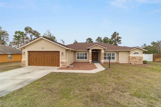 ranch-style home with a garage and a front lawn