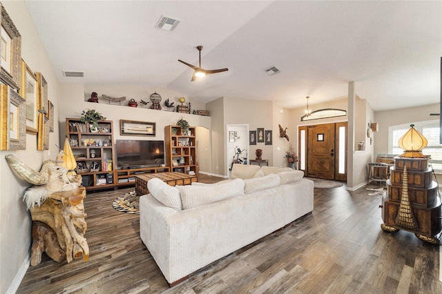 living room with vaulted ceiling, dark wood-type flooring, and ceiling fan