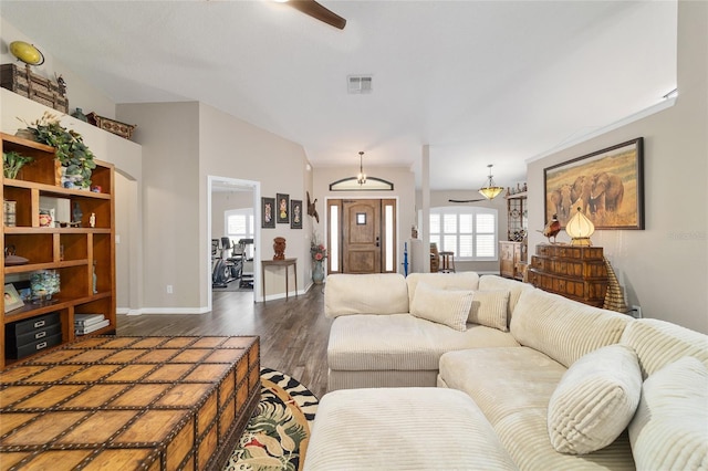 living room featuring ceiling fan and dark hardwood / wood-style flooring