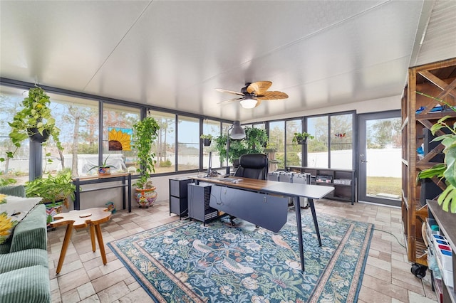 sunroom / solarium featuring ceiling fan