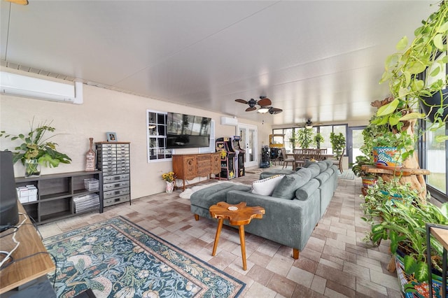 sunroom with ceiling fan and a wall unit AC