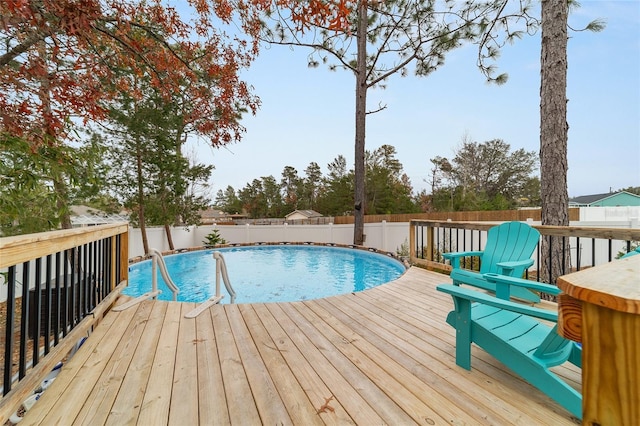 view of swimming pool with a wooden deck