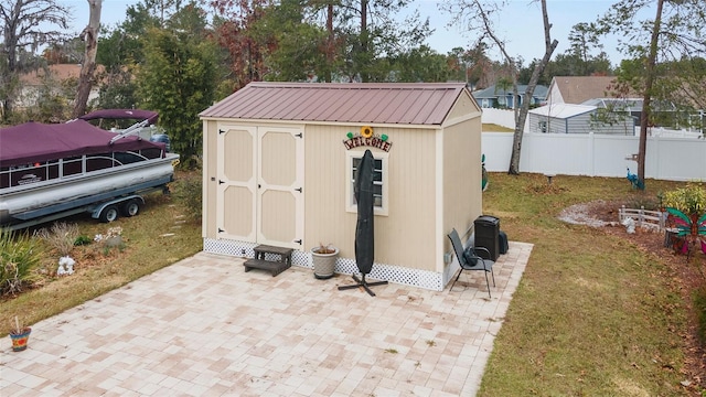 view of outdoor structure with a lawn