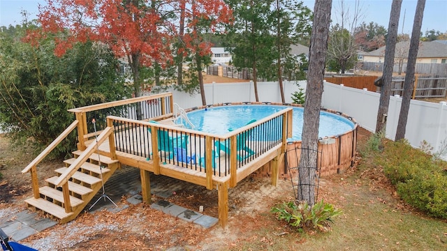 view of swimming pool featuring a deck