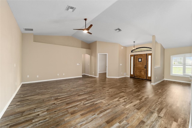 unfurnished living room featuring vaulted ceiling, visible vents, and dark wood finished floors