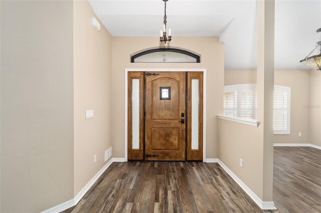 entryway featuring dark wood finished floors, visible vents, and baseboards