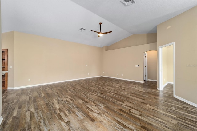 unfurnished living room featuring arched walkways, dark wood-style flooring, visible vents, and ceiling fan