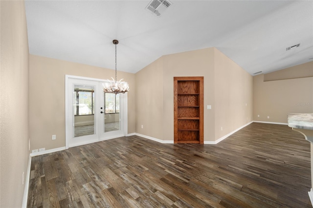 unfurnished dining area featuring vaulted ceiling, dark wood-type flooring, and visible vents