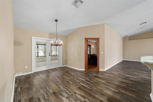 interior space with lofted ceiling, baseboards, visible vents, and dark wood-type flooring